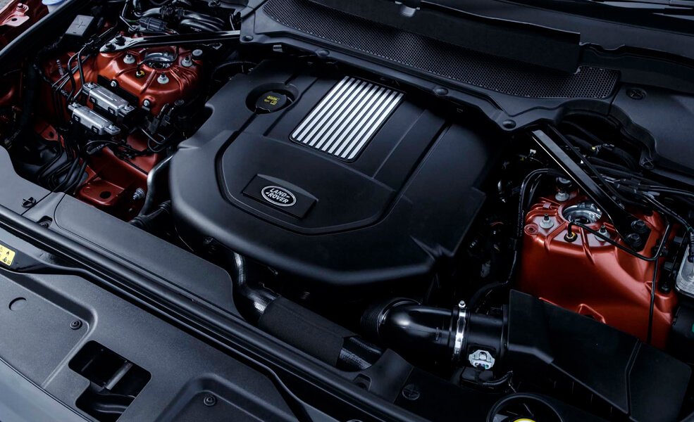 Land Rover engine being inspected by a mechanic